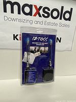 Photo of sealed retail packaging of Iztoss helmet to helmet intercom headset set with visible branding and two units inside.