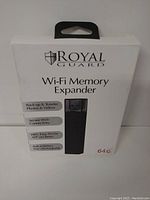 Front view of white retail box for Royal Guard Wi-Fi Memory Expander showing product image and key features including 64GB capacity.