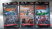 Front view of three sealed Marvel Legends action figure carded packages: Secret Wars Mechanical Masters, Defenders of Asgard, Shield-Wielding Heroes sets.