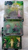 Princess Leia with Sail Barge Cannon, Darth Maul with Attack Dub, and Amanaman unopened action figures in blister packaging.