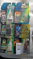 Full lot layout showing five Star Wars action figures in original packaging with Darth Vader header cards, including characters Princess Leia (ceremonial dress and white outfit), Darth Vader, Boba Fett, and Chewbacca.
