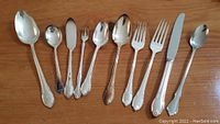 Photo showing a selection of the flatware including spoons, forks, knives in the 1847 Rogers Bros. Remembrance silver plate pattern.