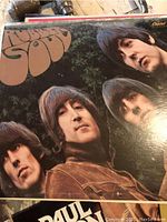 Close-up of The Beatles Rubber Soul album cover showing band members with some wear on cover