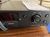 Front left angle of Sony DVD/CD player showing controls and model number DVP-NS325