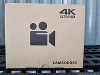 Front view of camcorder box with camera icon and 4K Ultra HD label.