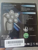 Back of Aidalls Wellup electric shaver box showing product specs and contents