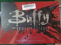 Front view of red and black box set cover with Buffy the Vampire Slayer logo and title 'The Complete Series'.