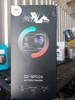 Front view of the Cooau CU-SPC06 4K action camera box showing branding and features like 4K, remote control, time lapse, 20MP, Wi-Fi, 2.35 inch display.