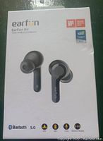 Photo of the EarFun Air true wireless earbuds retail box showing product image and key specifications like Bluetooth 5.0, IPX7 waterproof, 30hr playtime, wireless charging and microphone.
