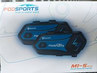Photo of two FODSports M1-S Plus Helmet Bluetooth Intercom devices showing front and side detail