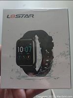 Original sealed packaging of L8STAR fitness tracker showing product image and branding.