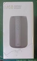Photo of M68 Portable Speaker in its white retail box with product image and model name.