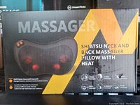 Box front showing massager pillow and basic description with heat, shiatsu massage for neck and back.