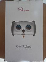 Front of the product box showing the owl robot image and Skymee branding.