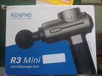 Front view of Renpho R3 Mini Massage Gun box showing product image and model name.