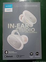 Front of box showing Soundcore Liberty 2 Pro earbuds with branding and key features including Bluetooth, Qualcomm aptX, wireless charging, and 32 hour playtime.