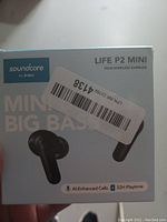 Front retail box of Soundcore Life P2 Mini true wireless earbuds showing brand, model, and key features with barcode sticker on front.