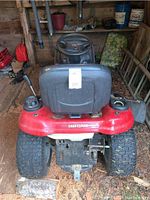 Rear view showing seat, rear tires, hitch plate and Craftsman logo on back fender