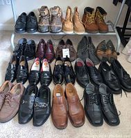 Wide photo showing four rows of men's shoes laid out on the floor with a mix of dress shoes and boots in various colors and styles.