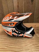 Side view of the full face helmet showing colors and graphics.