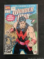 Front cover of 1991 Marvel Comics Wonder Man comic book featuring an illustration of Wonder Man and a dinosaur with promotional text about a free poster inside.