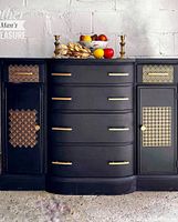 Full view of black and gold Art Deco style sideboard buffet with curved drawers and side cabinets