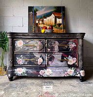 Front view of painted wooden credenza with four drawers and floral decoupage.