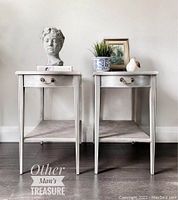 Front view of both side tables showing drawers, lower shelf, and overall refinished pearl glaze finish in beige and white with hints of pink.