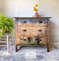 Front view of the dresser showing painted Venice scene, three drawers, and metal cup handles