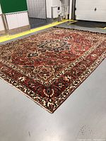 Perspective view of full rug on floor showing overall pattern and colors