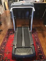 Front view of the BowFlex TreadClimber showing dual tread runners and control panel section with handles.