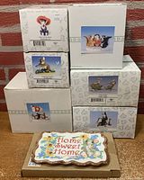 Original boxed Charming Tails figurines stacked with wall plaque in front