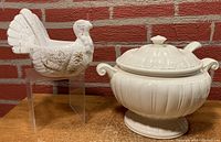 Photo showing the turkey-shaped gravy boat and the lidded tureen side by side, both with matching ladles.