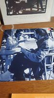 The Style Council vinyl album cover showing two men in black and white sitting at a table outdoors