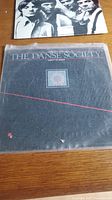 The Danse Society vinyl record album cover with dark background and floral emblem.