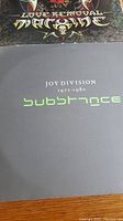 Joy Division “Substance 1977-1980” front cover with part of The Cult “Love Removal Machine” above