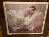 Close-up view of the print showing the reclining woman in soft white dress, highlighting the fabric details and peaceful pose.