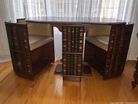Front view of games table and two slide-in chairs in oval configuration