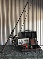 Fishing rod and fish finder side by side showing overall lot contents