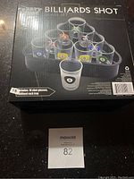Image of boxed billiard shot glass set with 10 shot glasses and tray depicted on box.