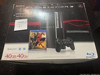 Front view of Sony PlayStation 3 Original 40GB box with Spider-Man game insert on box cover.