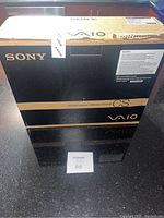 Original Sony branded box of Vaio CS Series laptop with pearl black coloring and CS series label.