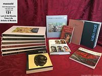 Photo showing the full lot of 13 art books including Time Life The World of series and other titles arranged on red cloth.