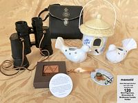Photo showing the Tasco binoculars with black leather carrying case, two white bird candle holders, ceramic bird house candle holder, and Art by Alyssa bird ornament with ribbon.