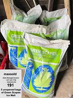 Five unopened bags of Green Scapes Ice Melt stacked, showing the front labeling and intact packaging.