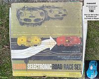 Original Eldon Selectronic Road Race Set box showing vintage graphic design of yellow and red slot cars with racing lanes and yellow text.