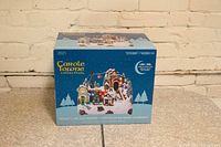 Box of Carole Towne Collection 2021 Mount Lake Ski Resort Christmas village with LED lights, front view showing branding and product image.
