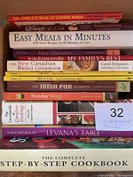 Stack of 12 cookbooks showing titles and colorful spine designs.