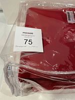 Curtain panel in clear plastic bag with MaxSold tag labeled "soundproof curtain" and lot number 75.