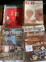 Photo showing multiple vintage magazines including Better Homes and Gardens, Good Housekeeping, House Beautiful with some torn and missing covers.